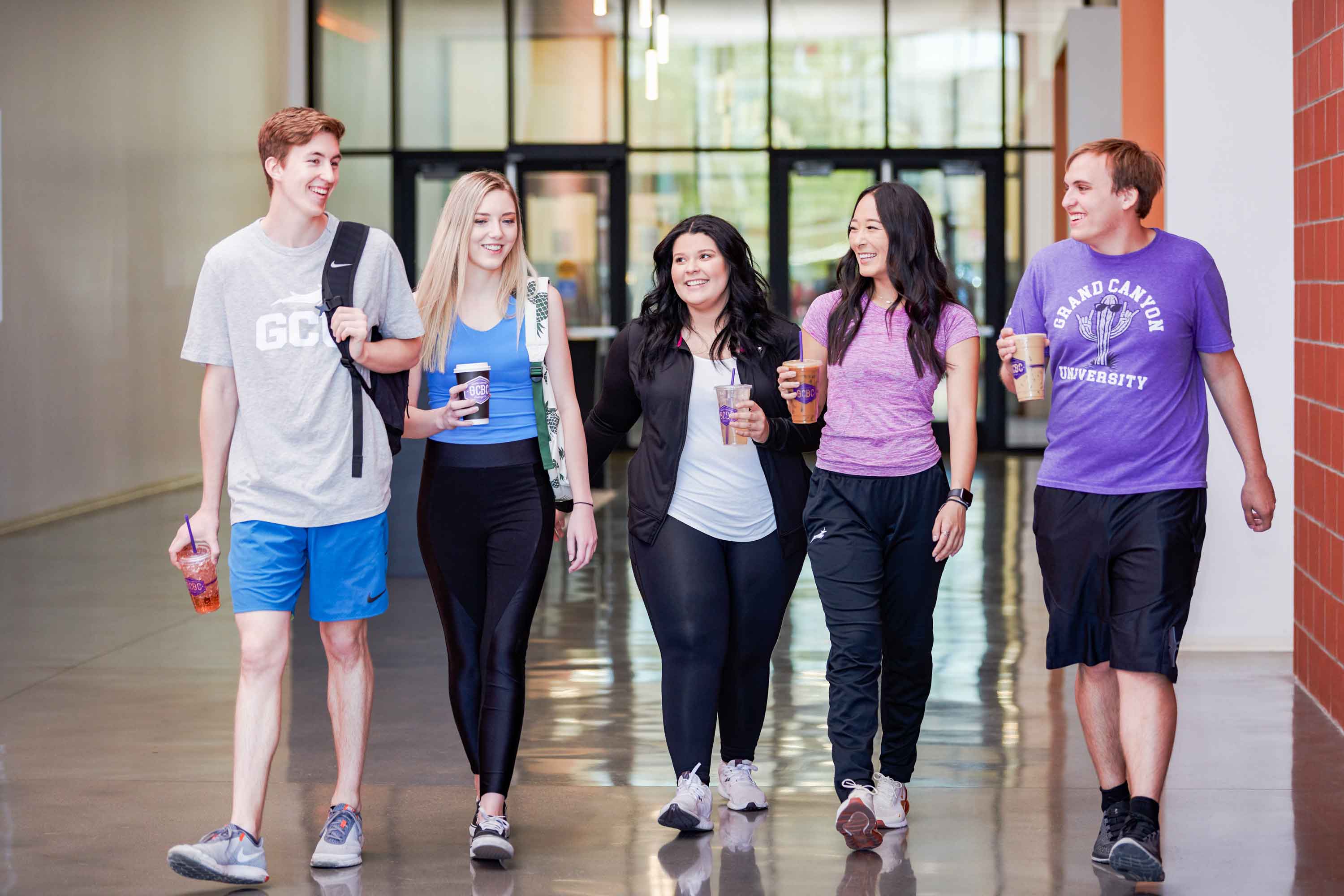GCU Students walking with GCBC drinks